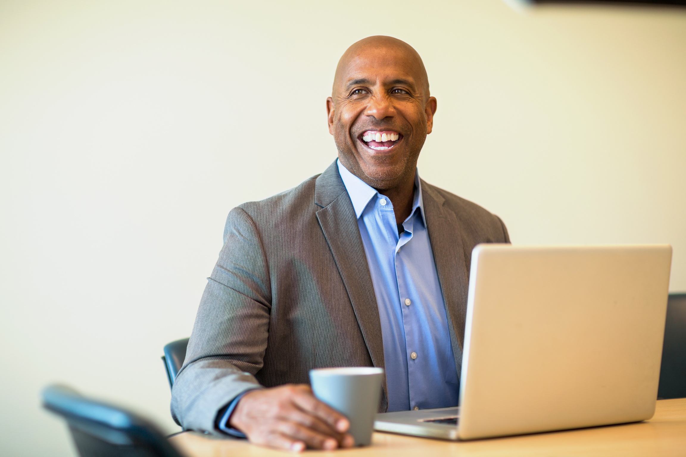 Happy Mature African American Man at Work.