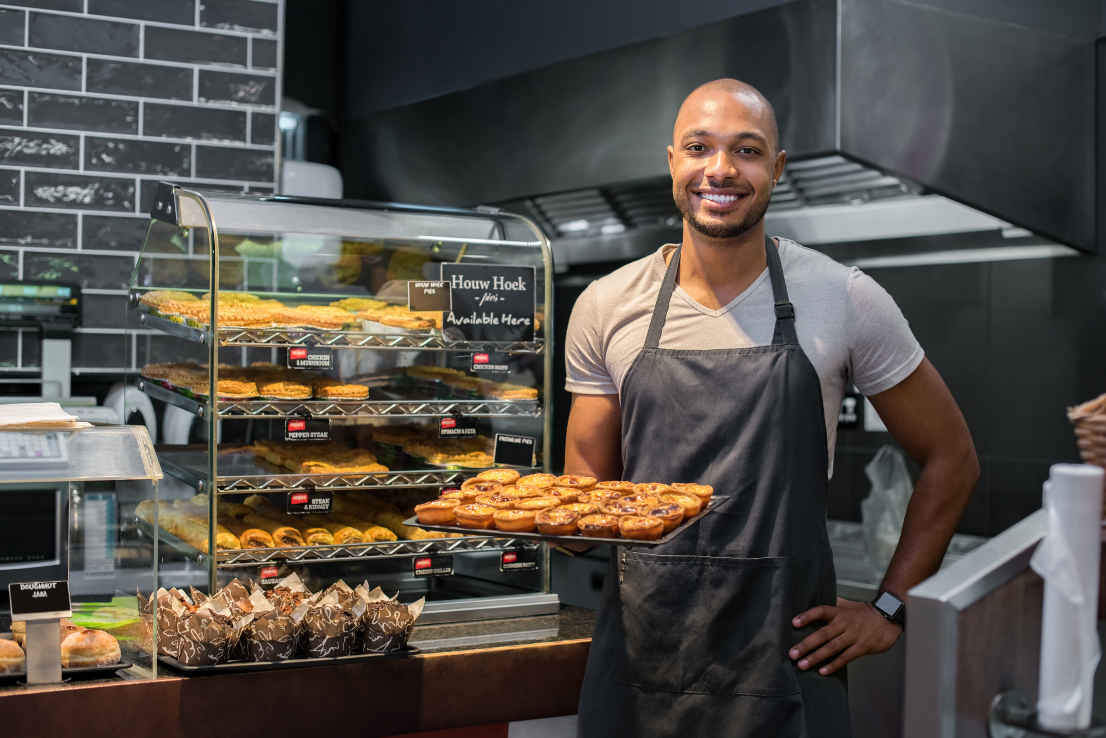 Pastry Chef Holding Small Pastry Tray of  Cake